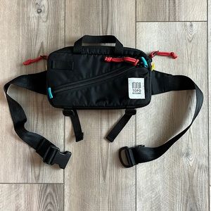 Topo Designs Black Belt Bag with Red and Blue Accents